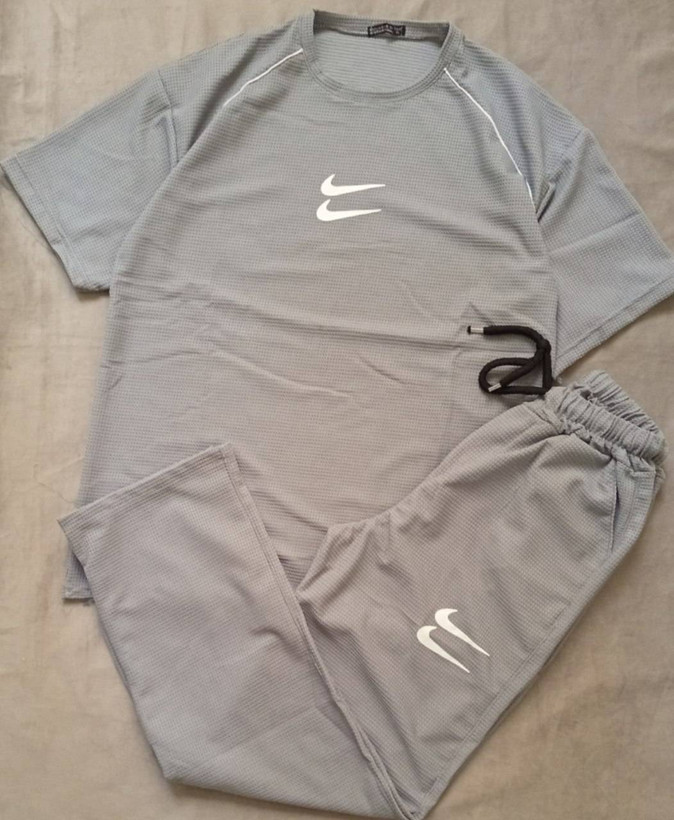ست تیشرت شلوار بیسکوییتی طرح دونایک جنس : بیسکویتی نسکافه - سرمه - مشکی - طوسی - سدری - سایزبندی مردانه